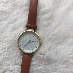 Brown strap watch with gold hardware